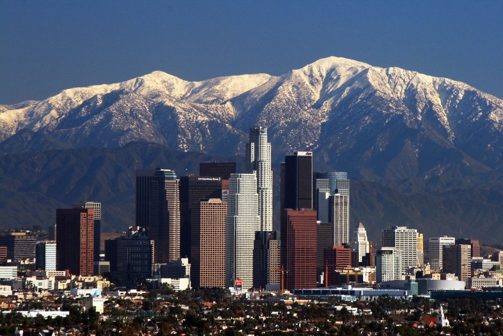 Photo of Los Angeles skyline and San Gabriel mountains via Wikimedia Commons