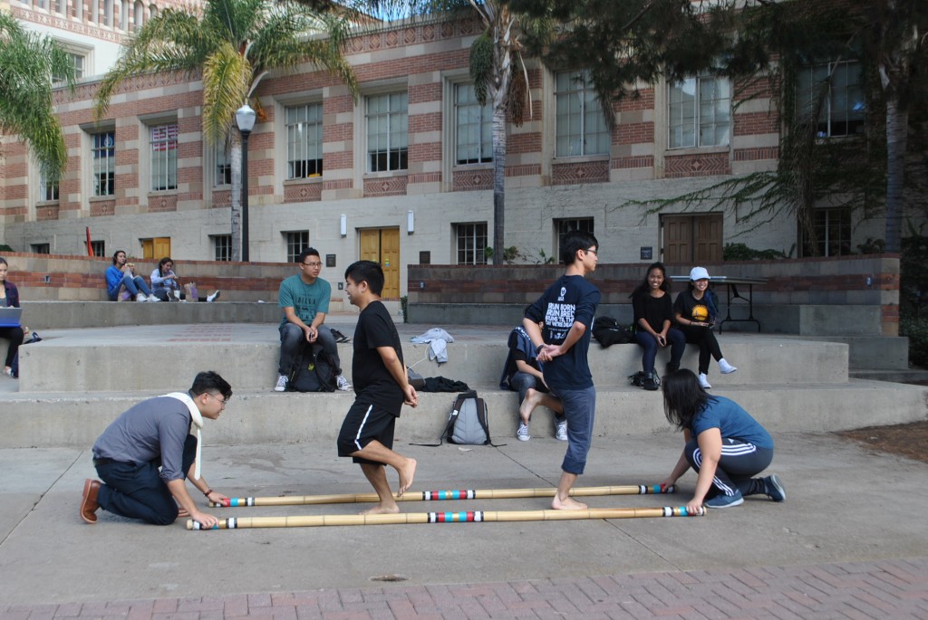 Members of Samahang Pilipino demonstrate the national dance, tinikling.